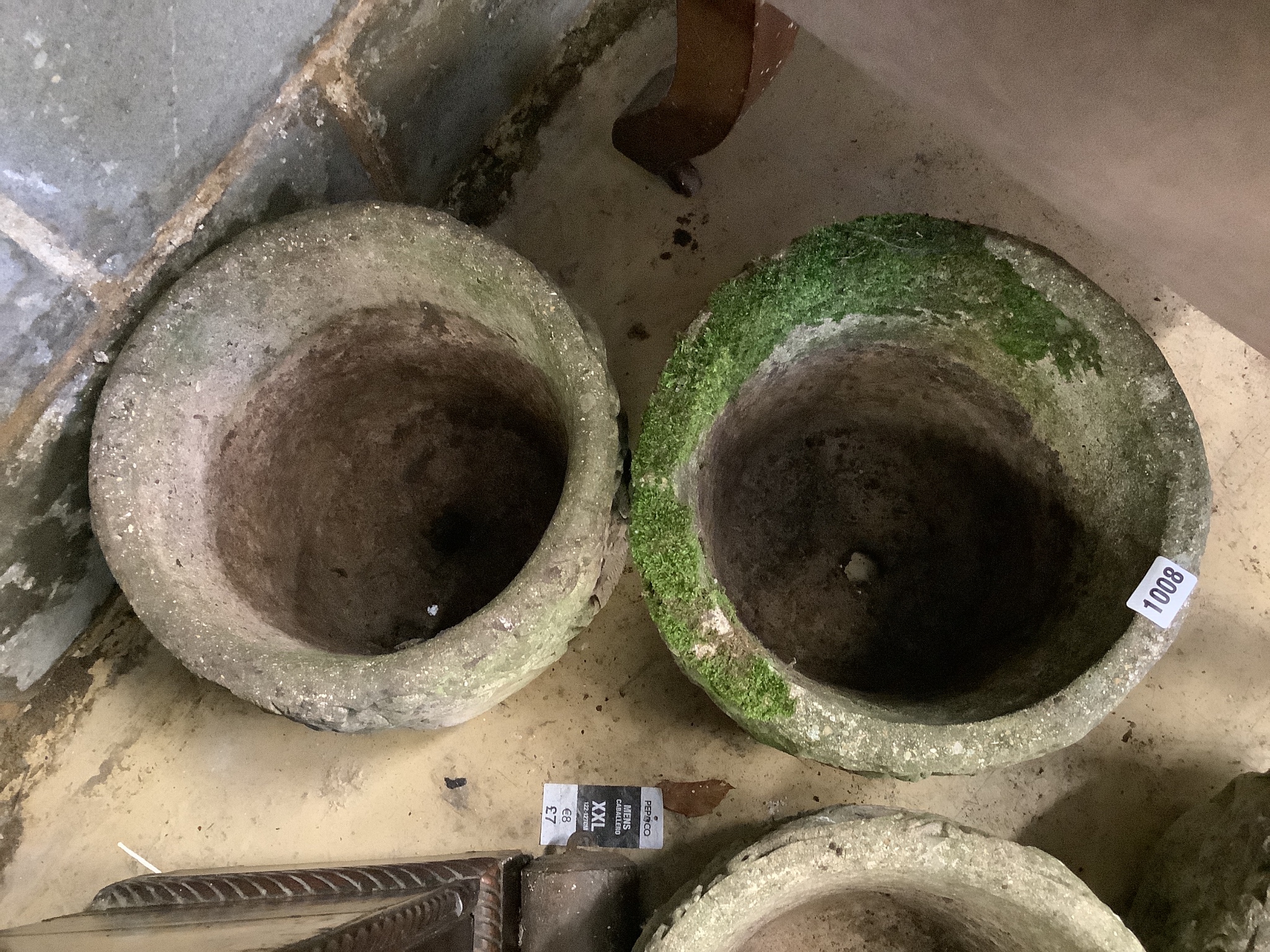 A set of four circular reconstituted stone garden planters, diameter 29cm, height 23cm